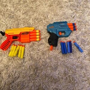 Two Nerf Guns 1 yellow & 1 blue with bullets